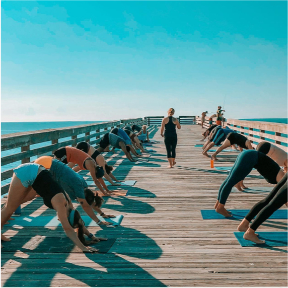 yoga practice on a pier