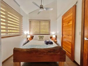 A Bedroom inside one of the Dragonfly Beach Retreat guest casitas.
